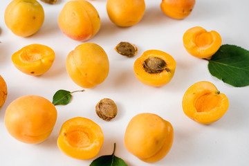 Many apricots on the white background. Top view