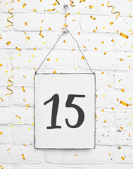 15 years old birthday party card with number fifteen with golden confetti