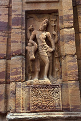 Carved figure if Shiva with Nandi, northern wall, Virupaksha temple, Pattadakal temple complex, Pattadakal, Karnataka. Northwest view. Northern mukha-mandapa is also seen.
