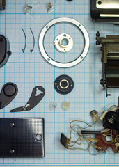 Obraz premium parts old retro film SLR camera on graph paper