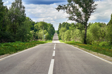 Fototapeta na wymiar Countryside road in Russia in summer