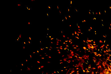 flame of fire with sparks on a black background
