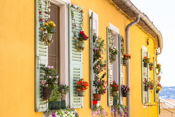 Old yellow house in Menton city in Provence, France