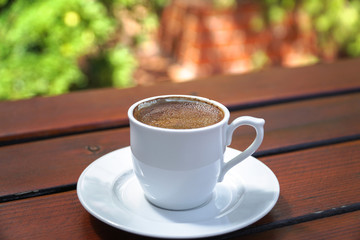 Fototapeta na wymiar Turkish Coffee Cup on a Wooden Table