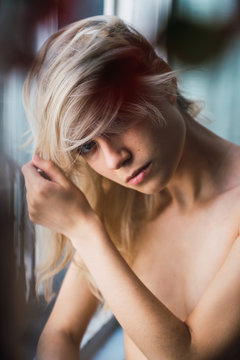Portrait of topless young woman