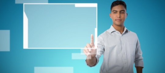 Man pretending to touch an invisible screen against abstract