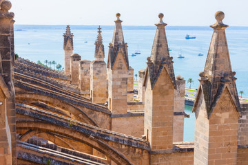 View over the sea with some boats from the terrace of the Cathedral of Santa Maria of Palma, also...