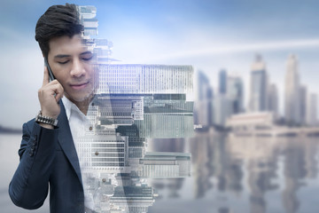 Double exposure businessman using mobile phone.
