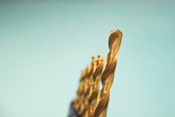 Yellow drills on a blue background.