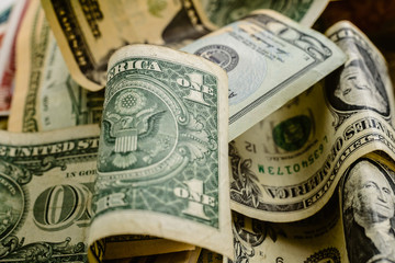 Wad of dollars bills on a table