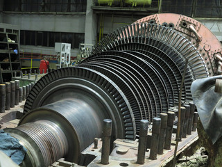 Disassembled steam turbine in the process of generator repair at power plant