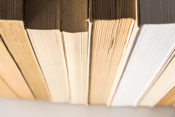 Many stacked books with white background with space