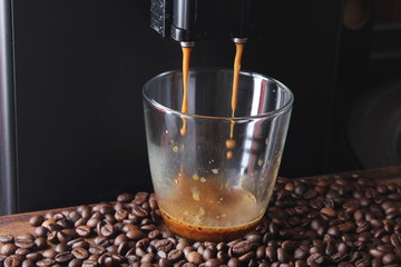 coffee glass coffee beanson a stone background a coffee machine