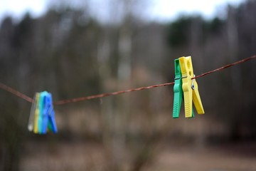 Fototapeta na wymiar Four colorful clothespins