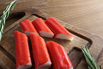 crab sticks on a wooden background