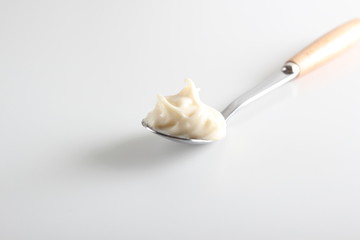Fototapeta na wymiar processed cheese in a spoon background