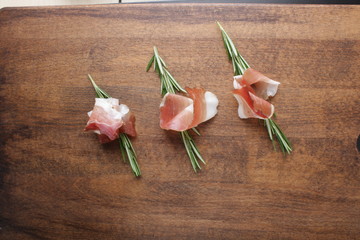 prosciutto, jamon on a wooden background