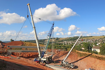 Crane lifting a bridge beam