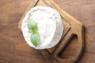 cheese brie on a wooden board
