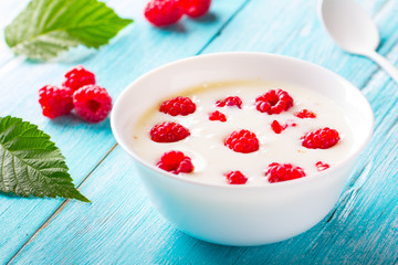 yoghurt raspberry berry fresh sweet berry wooden art background
