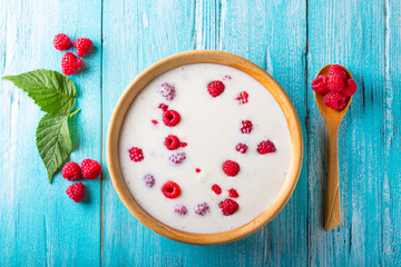 yoghurt raspberry berry fresh sweet berry wooden art background
