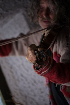 Senior man playing classical violin
