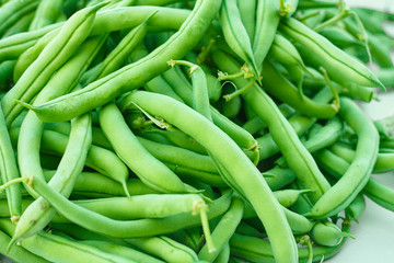 Pile of green beans, photographed on blurred background, natural fresh product