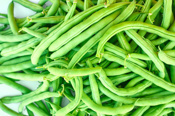 Pile of green beans, photographed on blurred background, natural fresh product