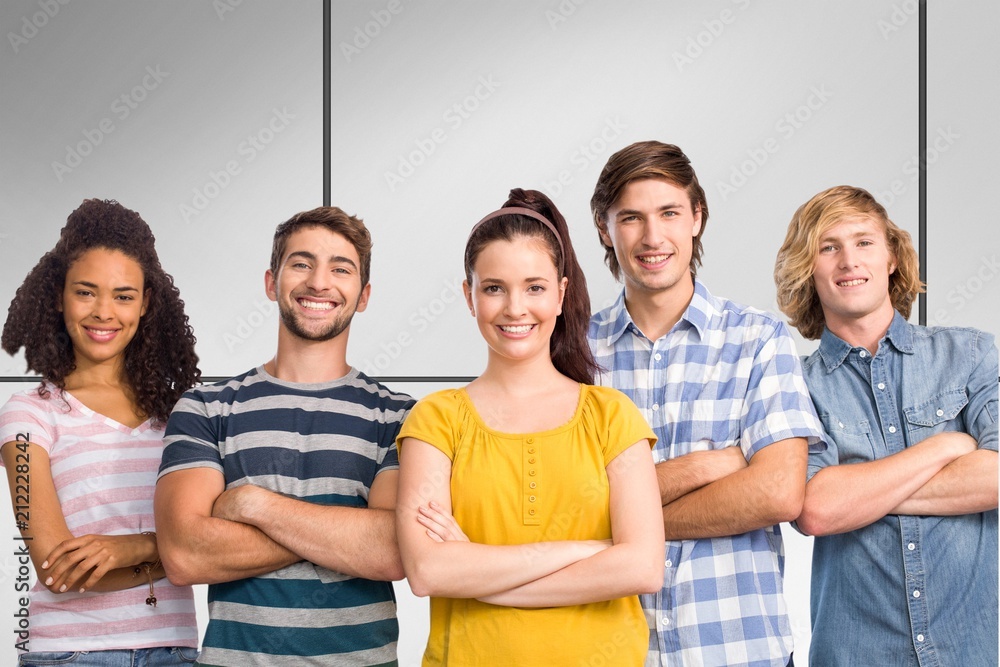 Wall mural Composite image of happy college students with arms crossed