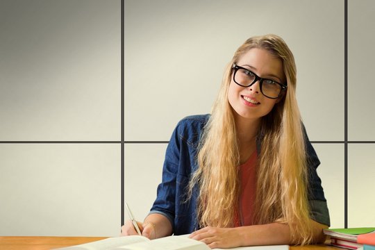 Composite image of student studying in the library 