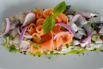 Fish mix with vegetables. Cold appetizer