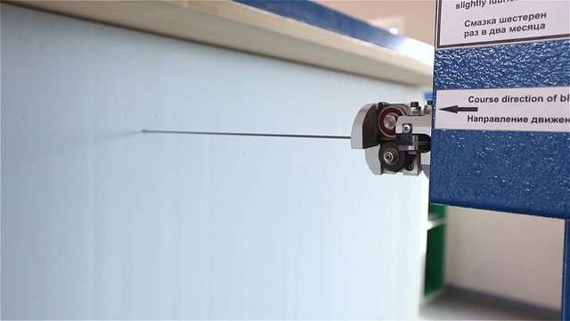 Closeup of polypropylene cube cutting machine, factory mattress, focus, macro, figured foam cutting