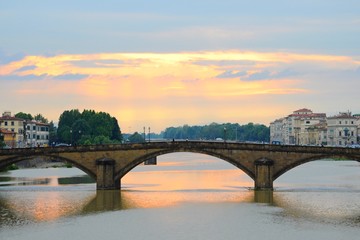 Obraz premium Ponte Alla Carraia Bridge at sunset on the Arno River, in Florence, Italy