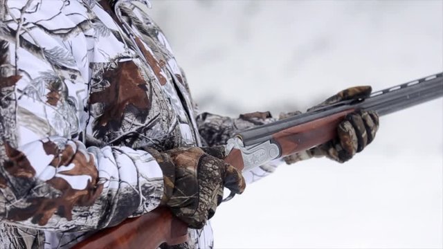 Smoking Gun. Shotgun shells being removed from shotgun with smoke coming out of it. Slowmotion 50 natural speed.