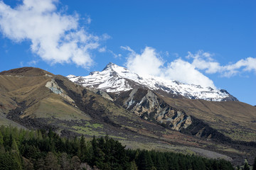 Fototapeta premium scenery of snow mountains range in New Zealand with blue clear sky