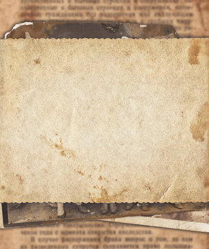 Vintage photo paper on old newspaper texture background