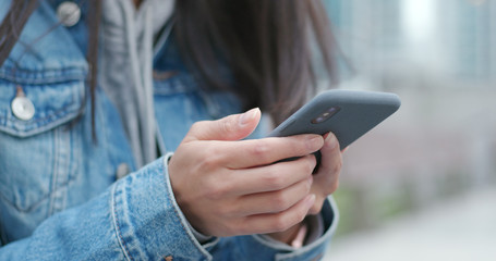 Close up of using smart phone at outdoor