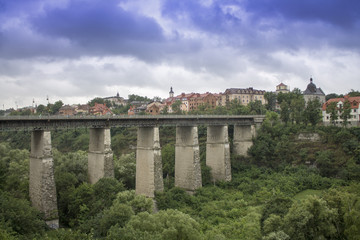 Fototapeta na wymiar Kamianets-Podilskyi, Ukraine - June 30, 2018: Photo of bridge to the Old Town of Kamenets-Podolsky.