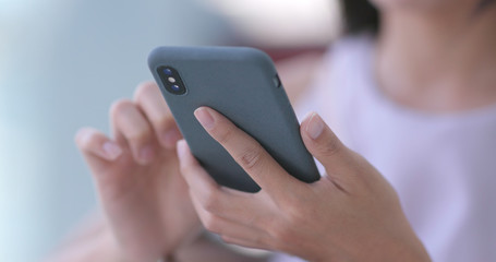 Woman use of mobile phone in shopping mall