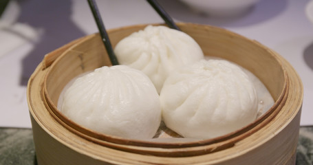 Steamed chinese bun in bamboo basket