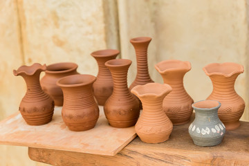 Fototapeta na wymiar different clay pots on a wooden table