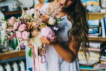 wedding bouquet in the hands of the bride