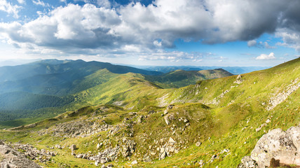 Mountains panorama with peaks, rocks and green nature