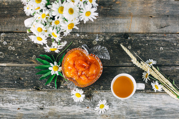 Cup of tea,  flowers, on dark wooden background