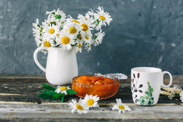 Cup of tea,  flowers, on dark wooden background