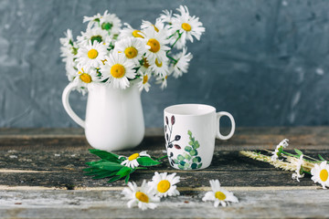Cup of tea,  flowers, on dark wooden background