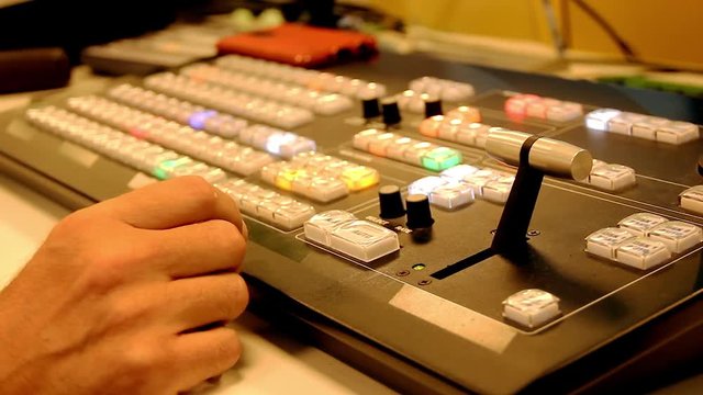 Closeup on television show production system. Professional equipment on studio set. Multi camera control desk. Broadcast network recording event concepts
