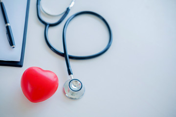 Red heart with stethoscope. Concept healthcare.