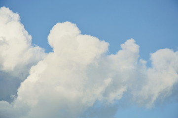 Naklejka na ściany i meble big cloud spreading on sky in sunny day