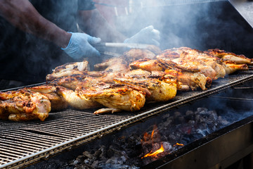 Chicken Grilling Over Open Fire on the Fourth of July at a Community Celebration
